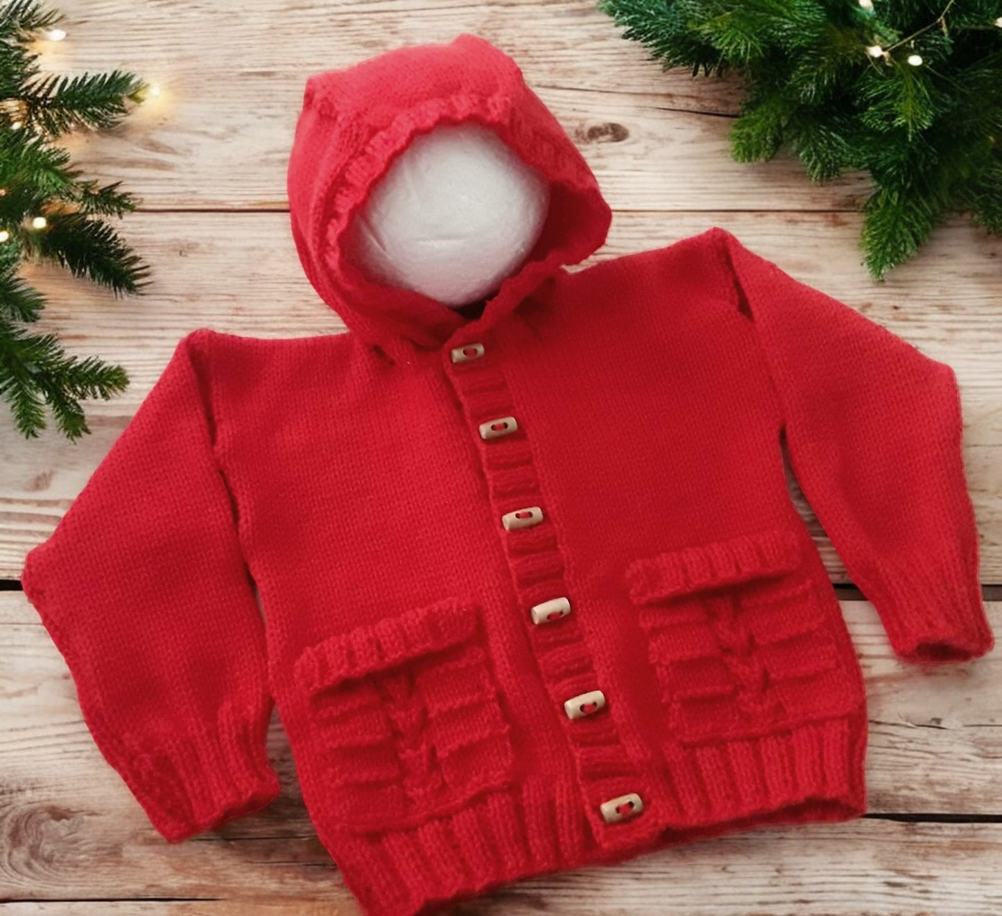 Unisex knitted hoodie with cable pockets