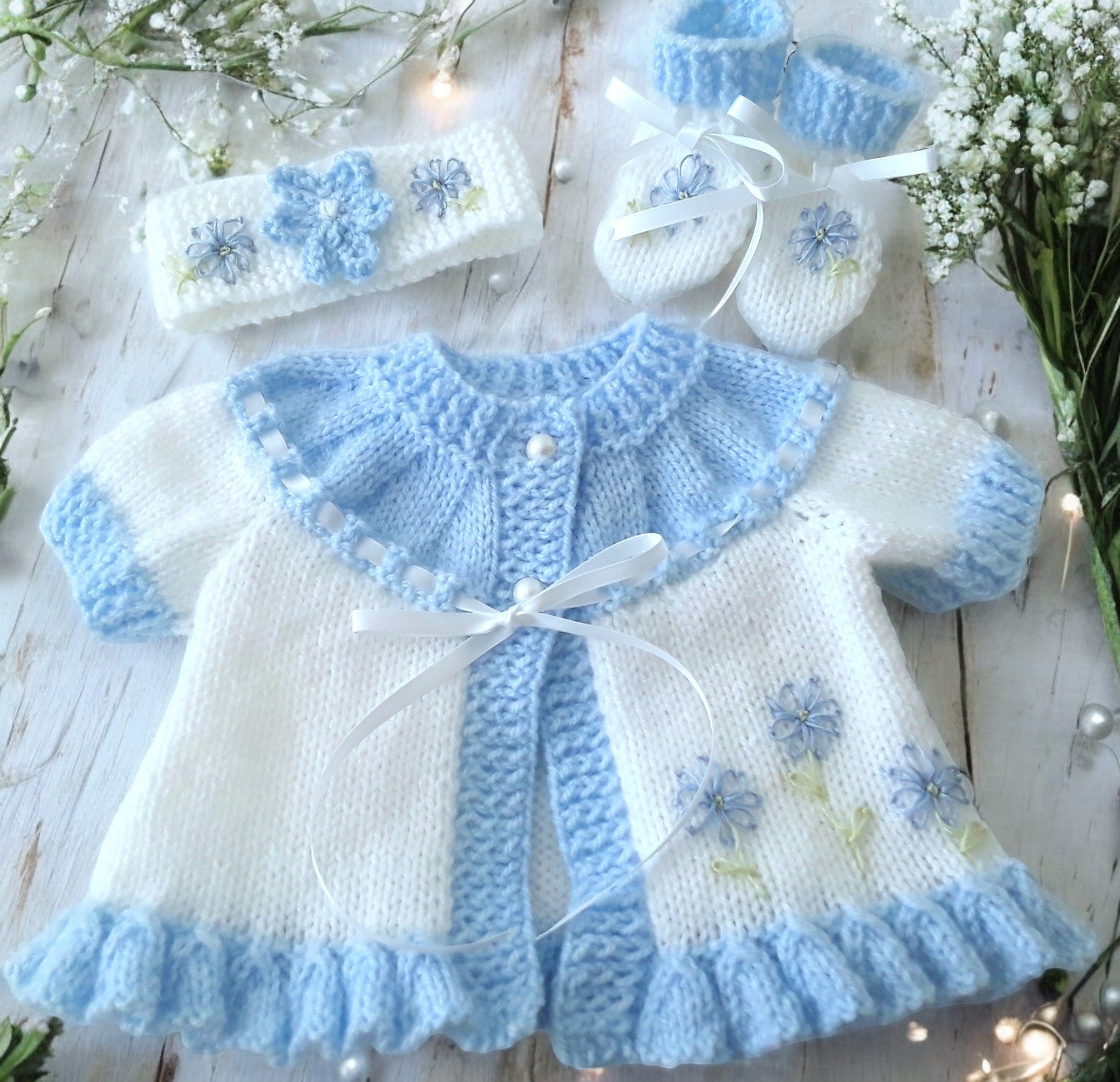 gemknits4kids hand knitted baby girl outfit in white & soft blue with floral embroidery, including cardigan, headband, boots