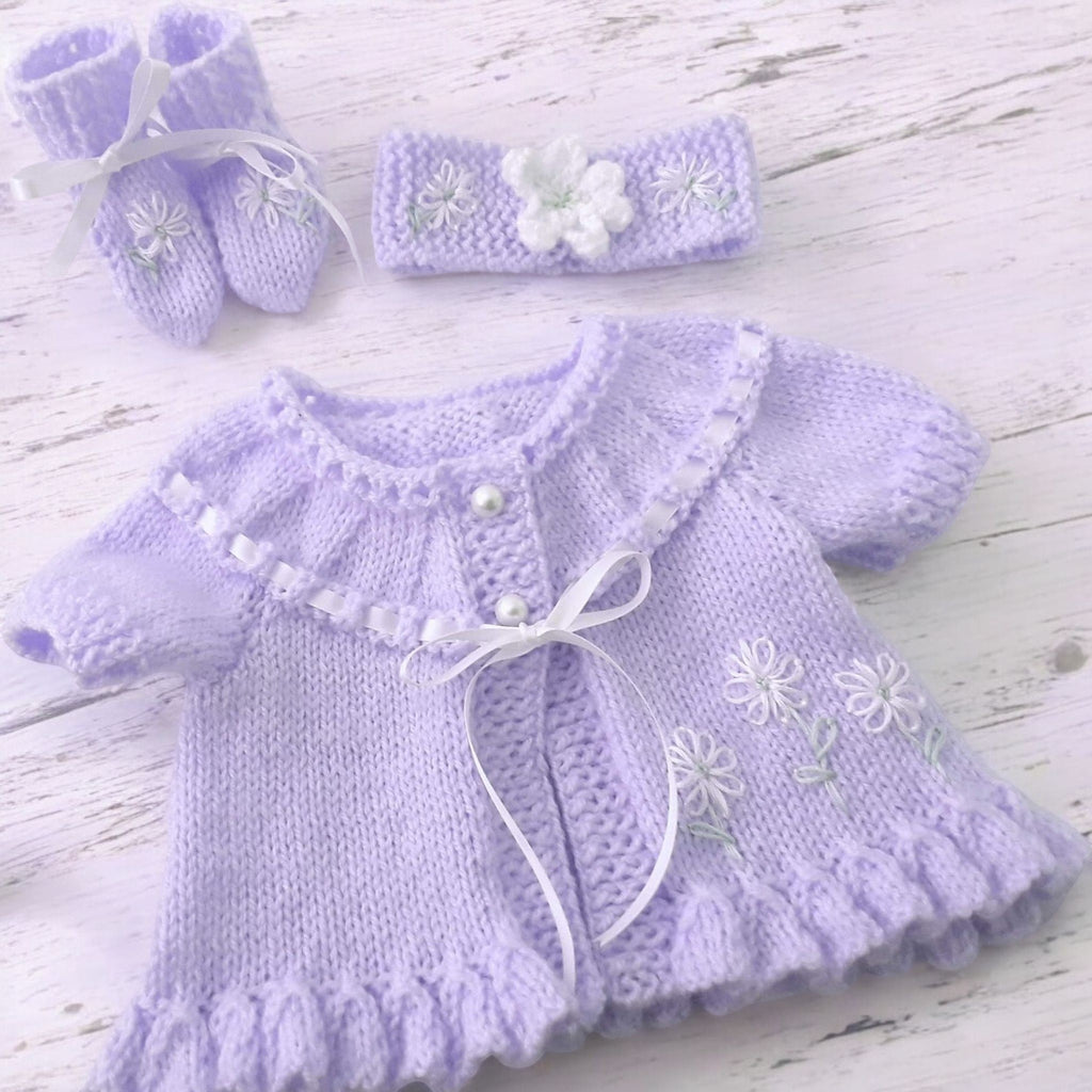 gemknits4kids hand knitted baby girl outfit in soft lilac with floral embroidery, including cardigan, headband, boots