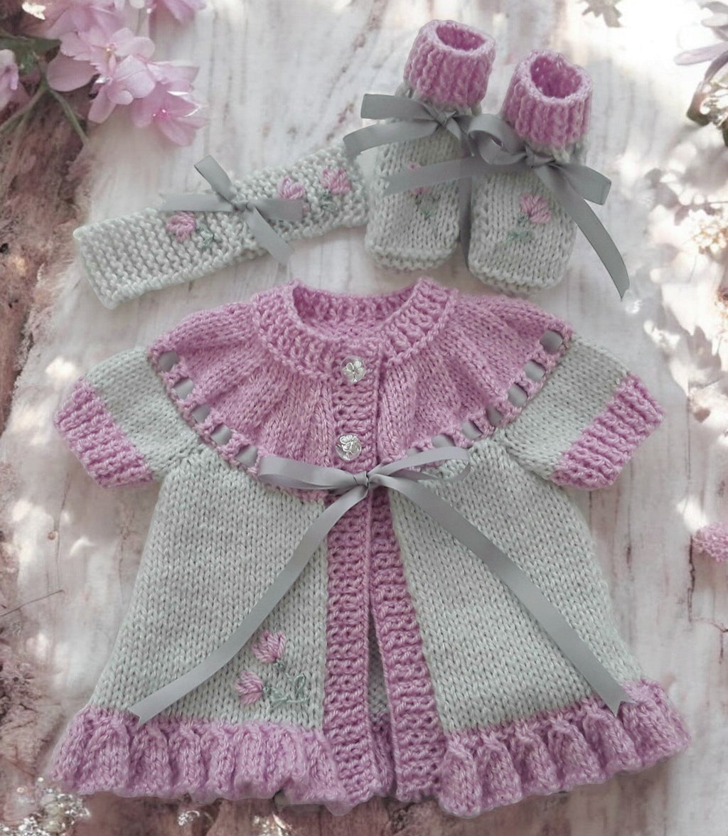 gemknits4kids hand knitted baby girl outfit in soft grey & rose  with floral embroidery, including cardigan, headband, boots