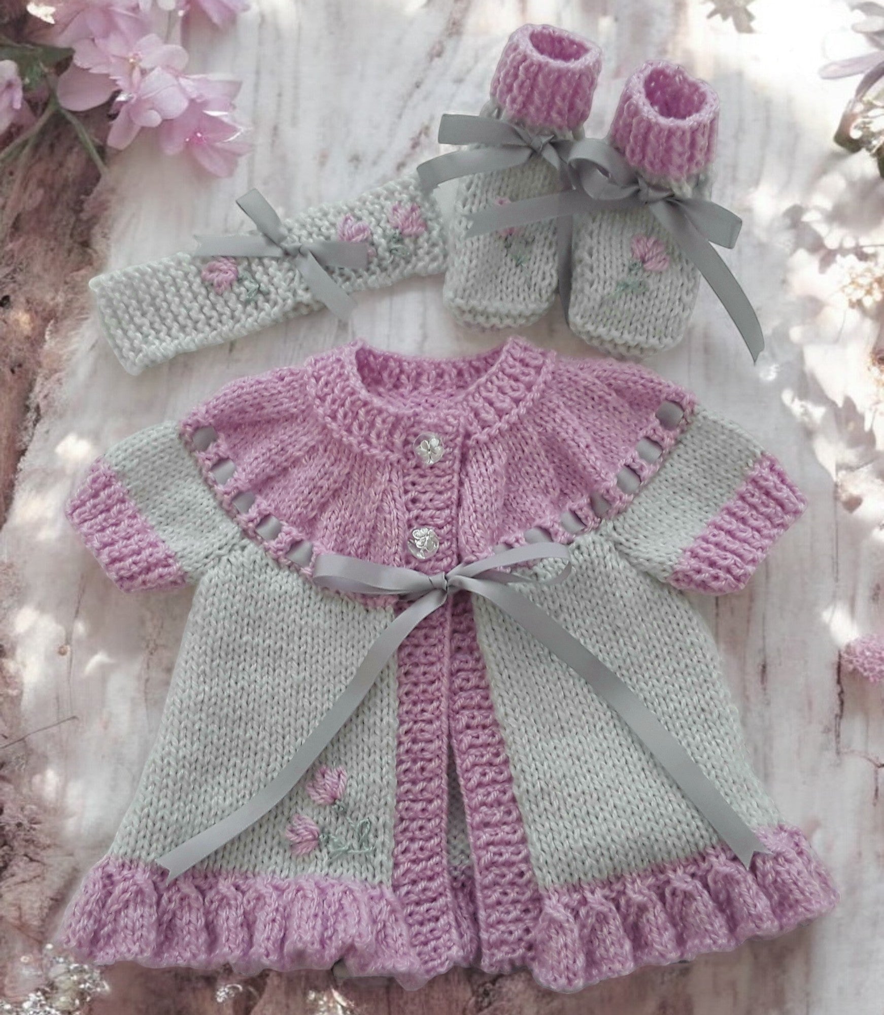 gemknits4kids hand knitted baby girl outfit in soft grey & rose  with floral embroidery, including cardigan, headband, boots