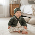 Designer hand knitted baby girl outfit with floral embroidery, frilly cardigan and coordinated hat in olive green