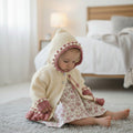 Designer hand knitted baby girl frilly cardigan with hood, floral embroidery in cream and dusky pink