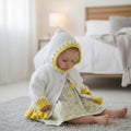 Designer hand knitted baby girl frilly cardigan with hood, floral embroidery in white & yellow