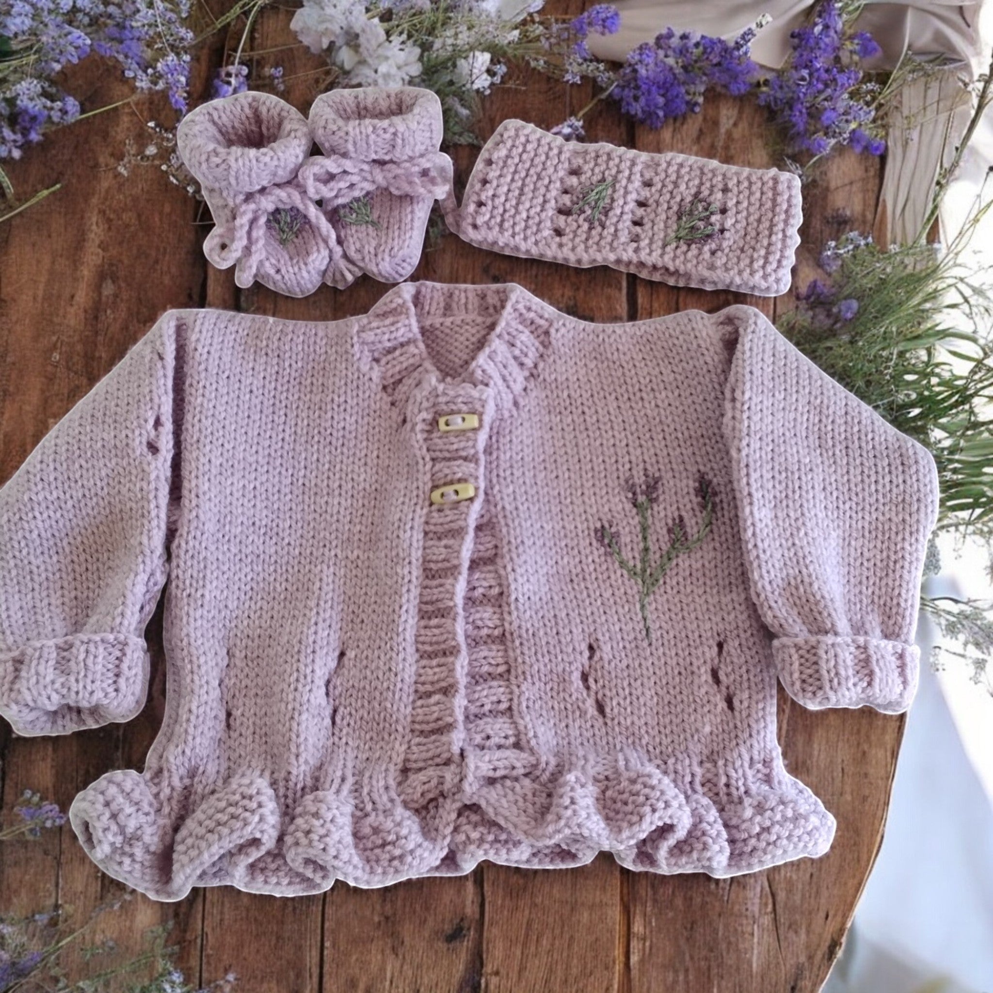 gemknits4kids hand-knitted lavender cardigan with matching headband and booties featuring delicate floral embroidery
