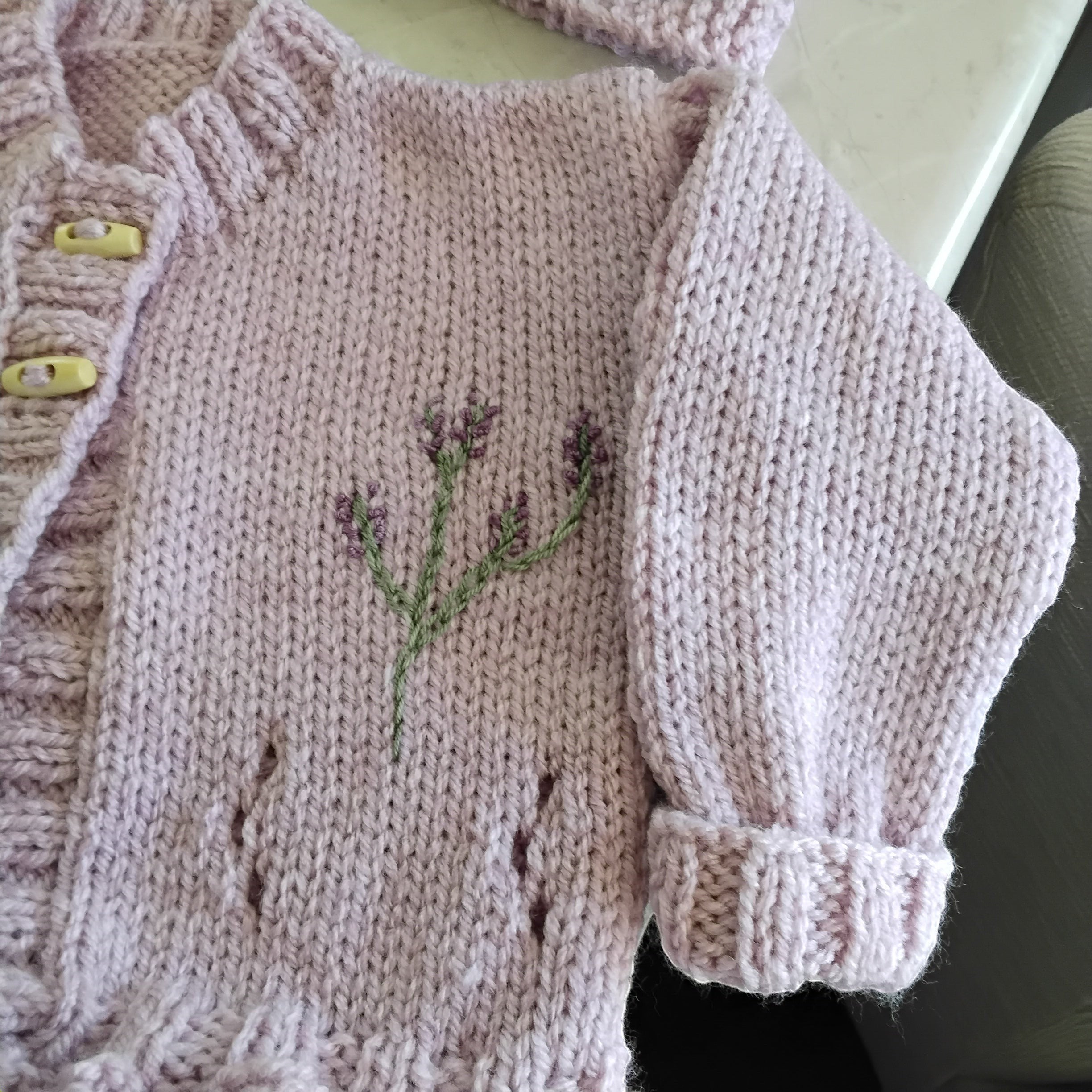 gemknits4kids hand-knitted lavender cardigan with matching headband and booties featuring delicate floral embroidery