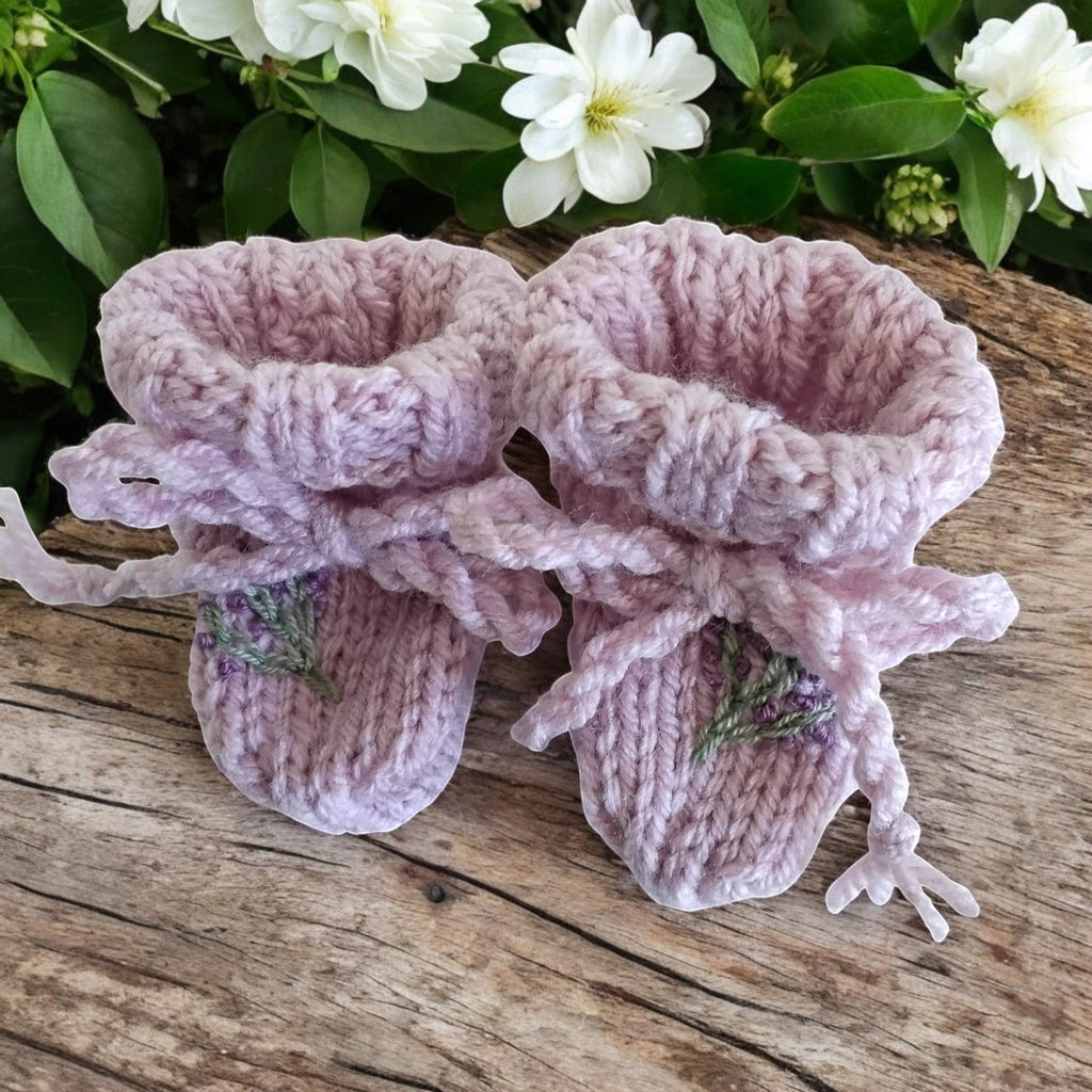 gemknits4kids hand-knitted lavender booties featuring delicate floral embroidery