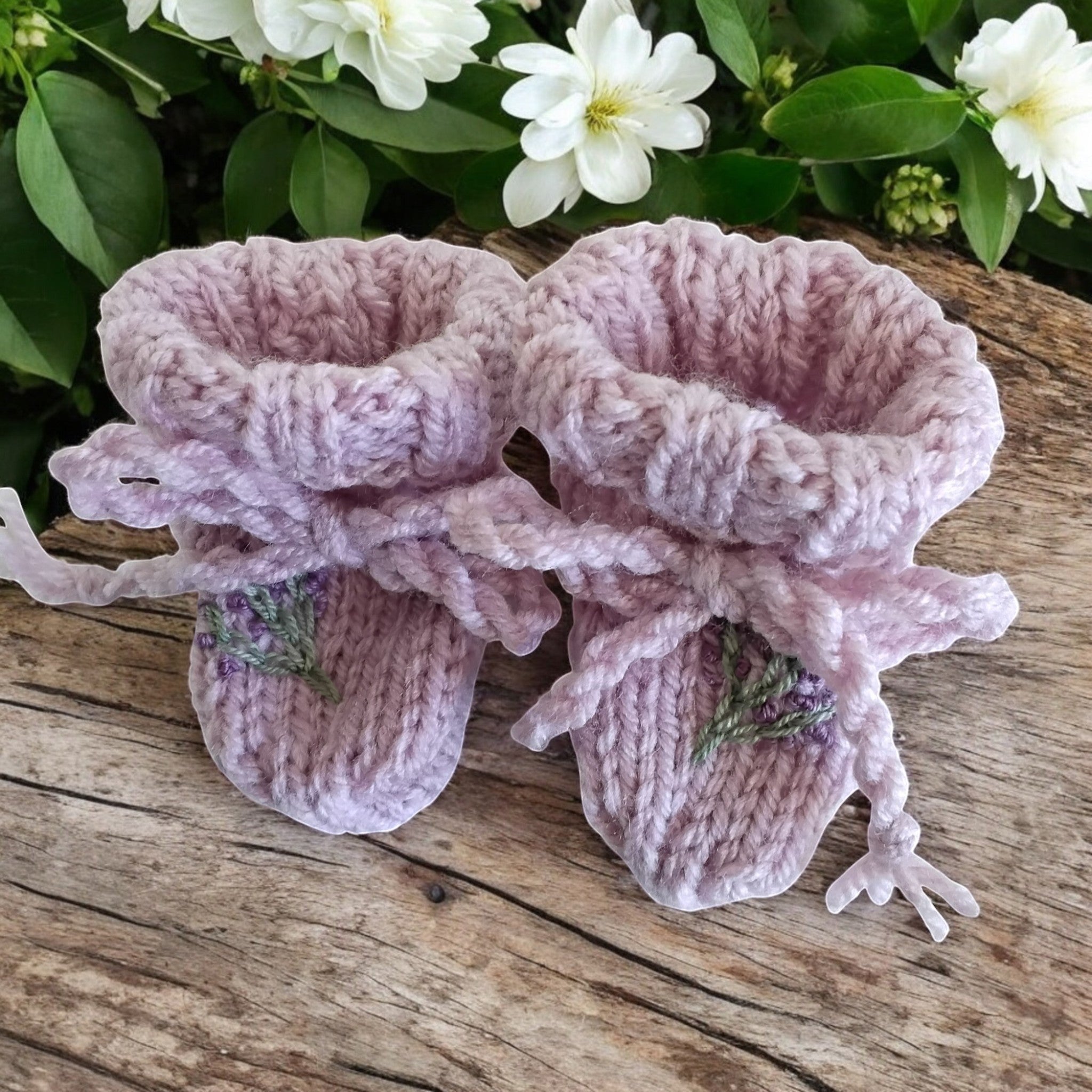 gemknits4kids hand-knitted lavender booties featuring delicate floral embroidery