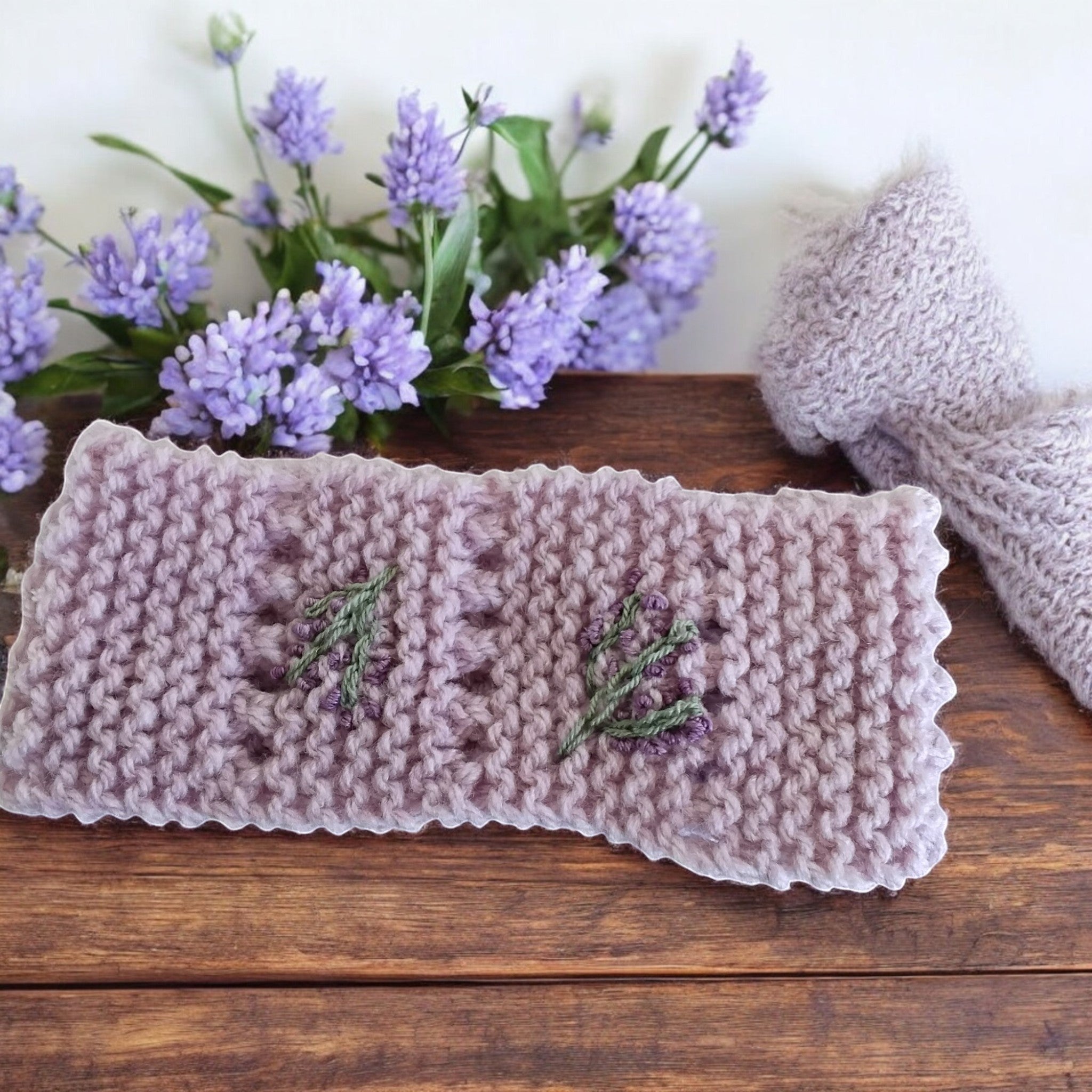 gemknits4kids hand-knitted lavender headband featuring delicate floral embroidery