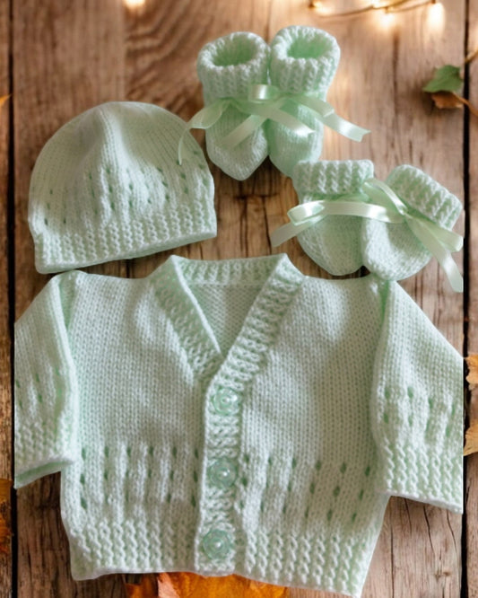 gemknits4kids baby wearing a soft mint hand-knitted cardigan, hat, and booties