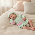 gemknits4kids hand knitted pastel green and pink cardigan with matching beanie hat featuring silk embroidered flowers