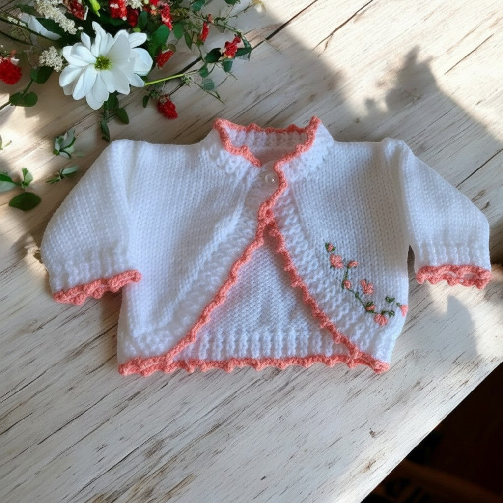 gemknits4kids white hand-knitted bolero cardigan for girls with peach trim and delicate floral embroidery