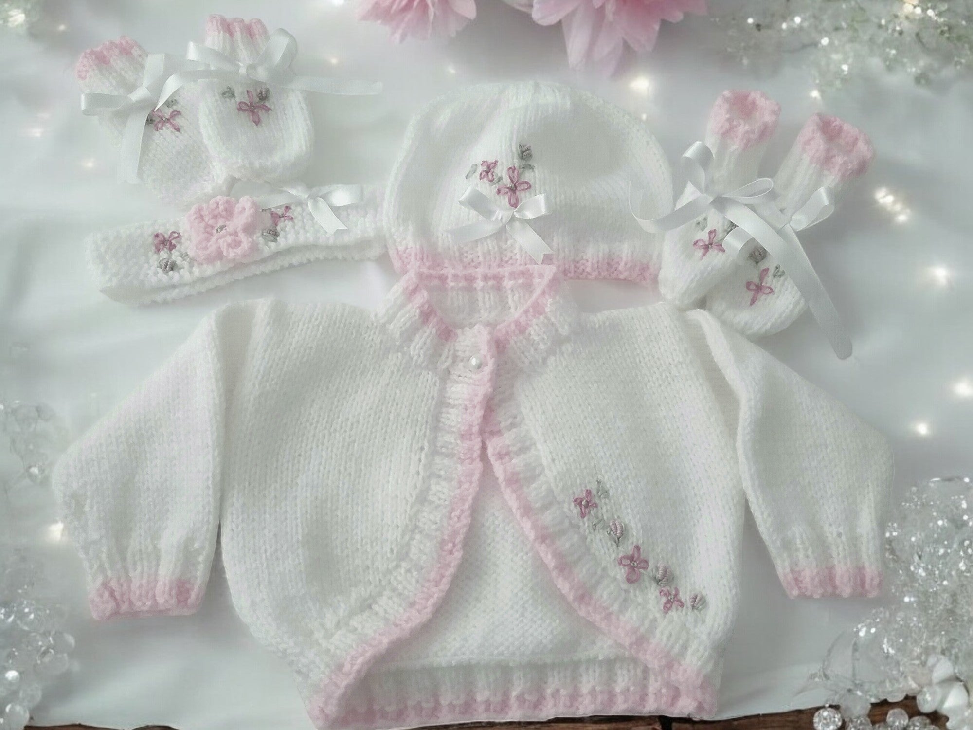 gemknits4kids white hand-knitted bolero cardigan with pink embroidery