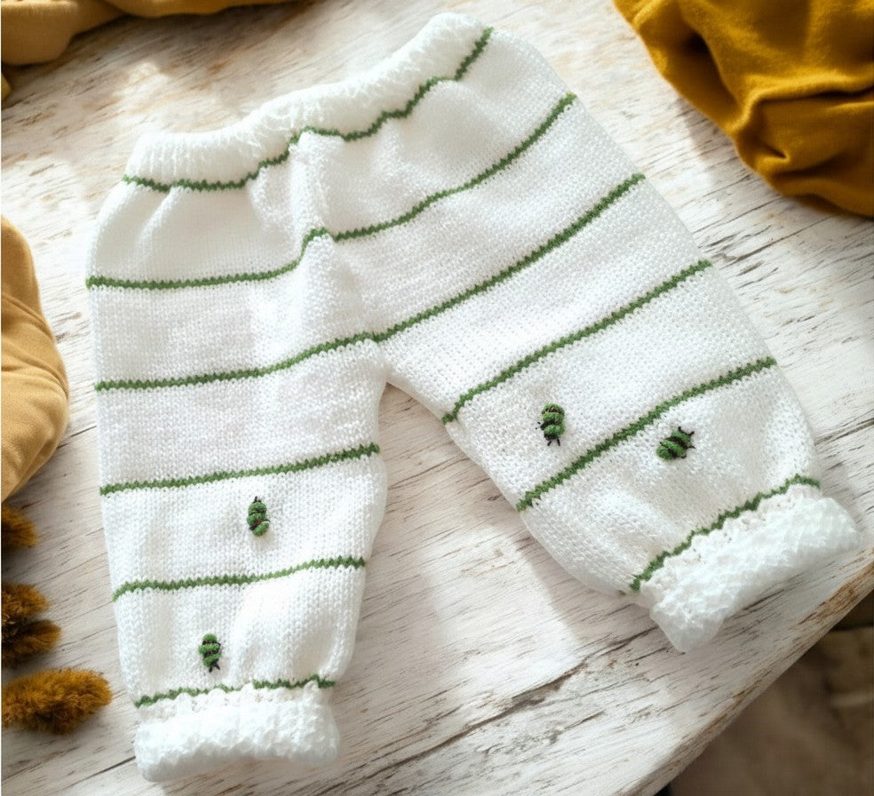 gemknits4kids white knitted baby leggings with green stripes and small bumble bee embroidery details
