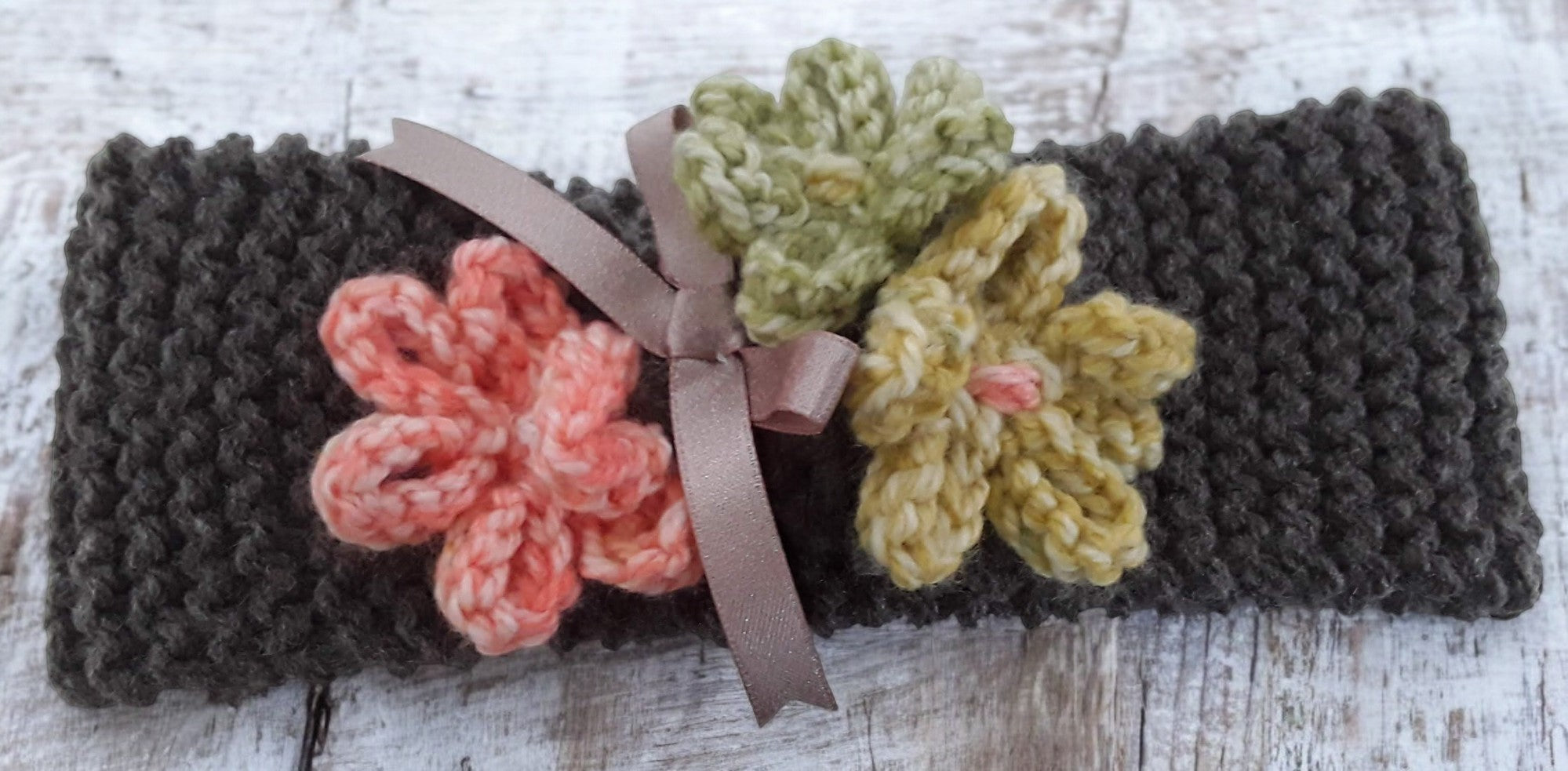 hand knitted headband with knitted flowers